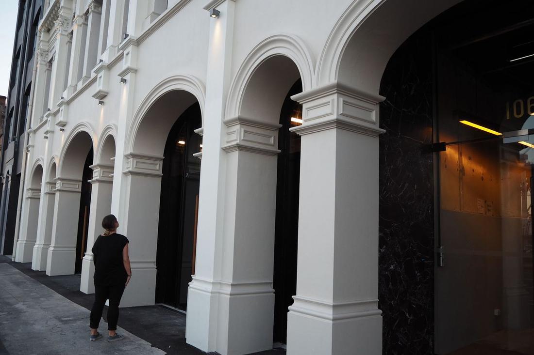 Medium shot of the Quay Building facade featuring restored plaster mouldings.